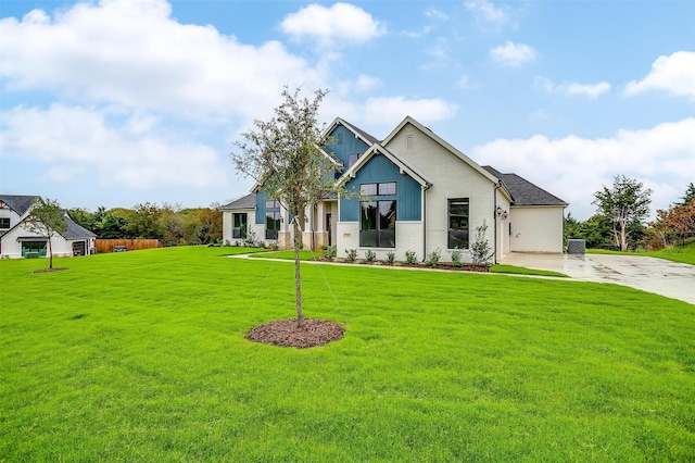 craftsman-style house featuring a front lawn and central AC