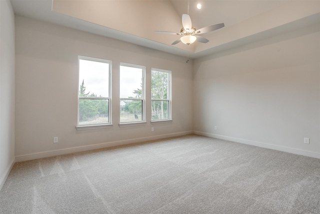 unfurnished room with light carpet and ceiling fan