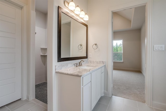 bathroom featuring vanity, walk in shower, and tile patterned floors