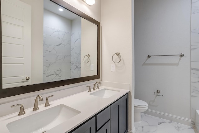 bathroom featuring toilet and vanity