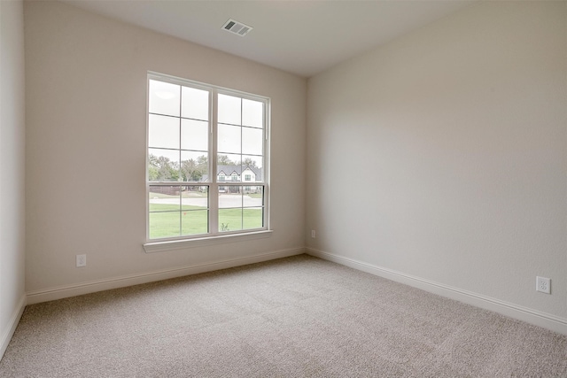 empty room featuring carpet flooring