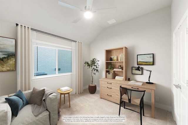 carpeted home office with ceiling fan and vaulted ceiling