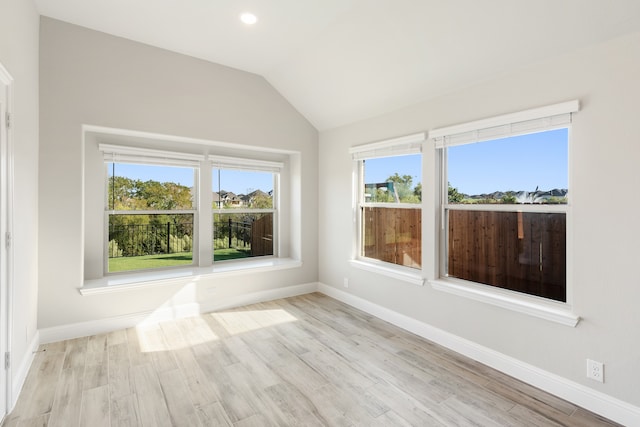 unfurnished sunroom with vaulted ceiling and a wealth of natural light