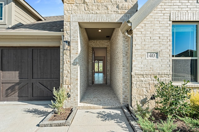 view of exterior entry featuring a garage