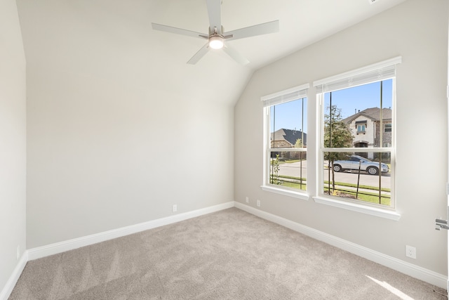 bonus room with light carpet, lofted ceiling, and ceiling fan