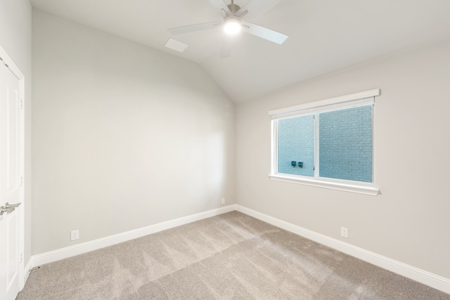 unfurnished room with light carpet, lofted ceiling, and ceiling fan