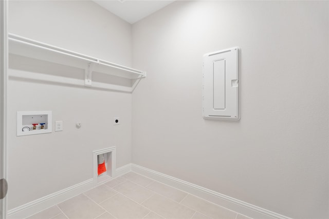 laundry room featuring light tile patterned flooring, gas dryer hookup, electric panel, washer hookup, and hookup for an electric dryer