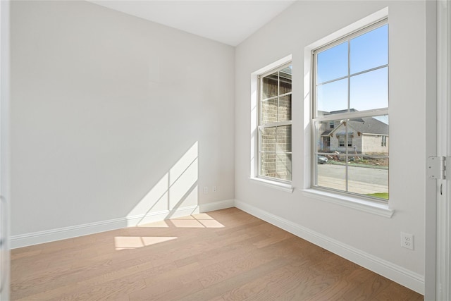 spare room featuring light hardwood / wood-style floors