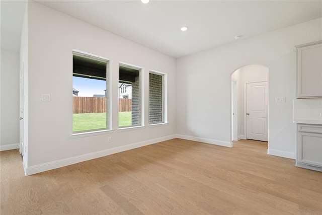 spare room with light hardwood / wood-style flooring