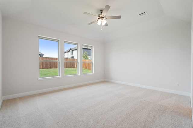 carpeted spare room with lofted ceiling and ceiling fan