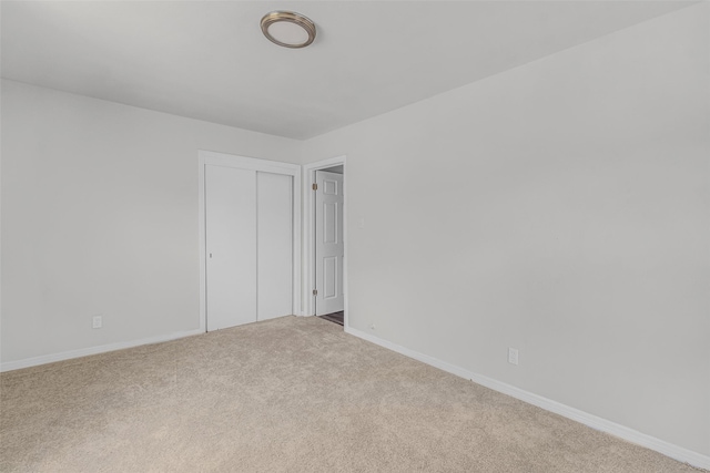 spare room with light carpet