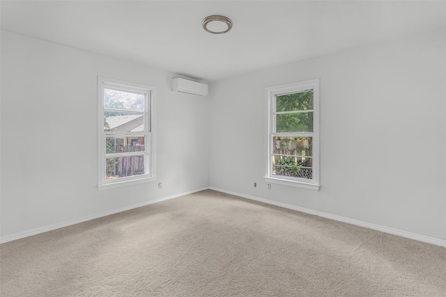 carpeted empty room featuring a wall mounted air conditioner