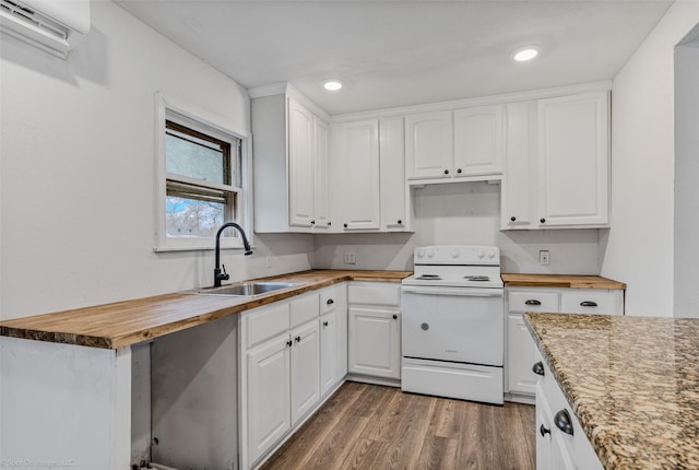 kitchen with white electric range, butcher block countertops, white cabinetry, sink, and a wall mounted AC