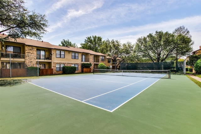 view of tennis court featuring basketball court