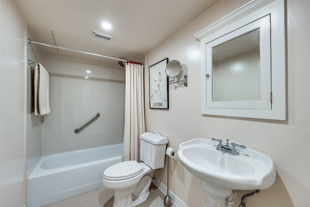 bathroom featuring a sink, visible vents, shower / bathtub combination with curtain, and toilet