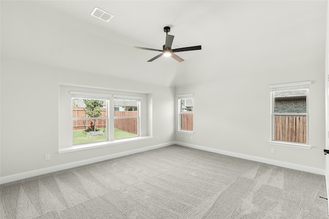 spare room with ceiling fan and light colored carpet