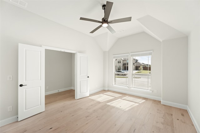 interior space with lofted ceiling, light wood-type flooring, and ceiling fan