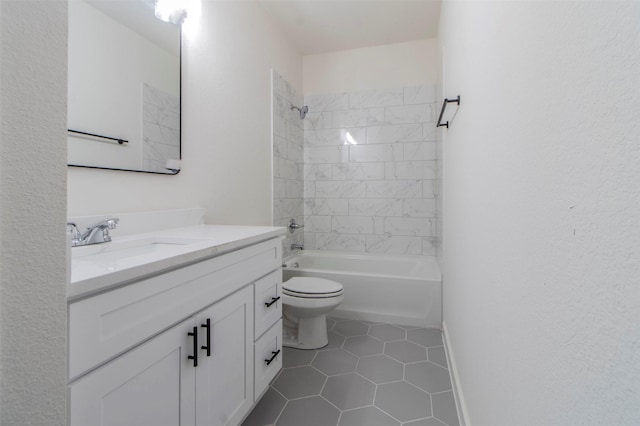 bathroom featuring vanity, baseboards, tile patterned flooring, toilet, and shower / bathtub combination