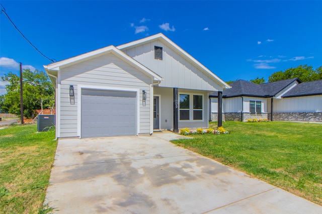 view of front of property featuring a garage and a front lawn