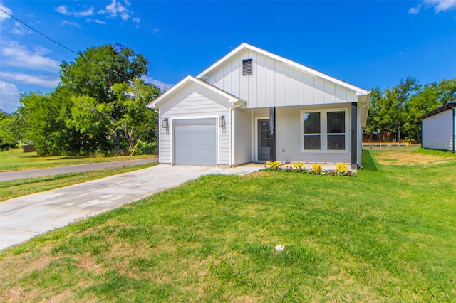 view of front facade featuring board and batten siding, an attached garage, driveway, and a front yard