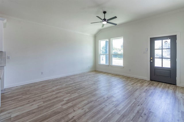 interior space with crown molding, a ceiling fan, baseboards, and light wood finished floors
