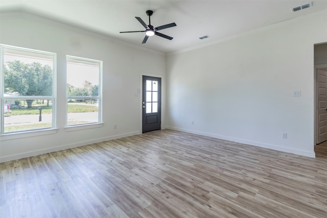 unfurnished room with light hardwood / wood-style floors, ornamental molding, and ceiling fan