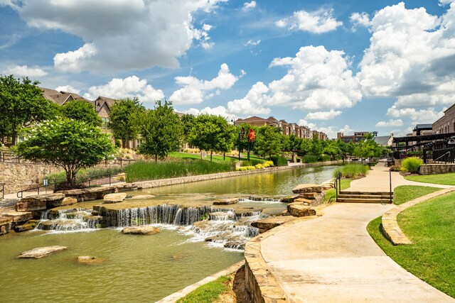 surrounding community featuring a water view