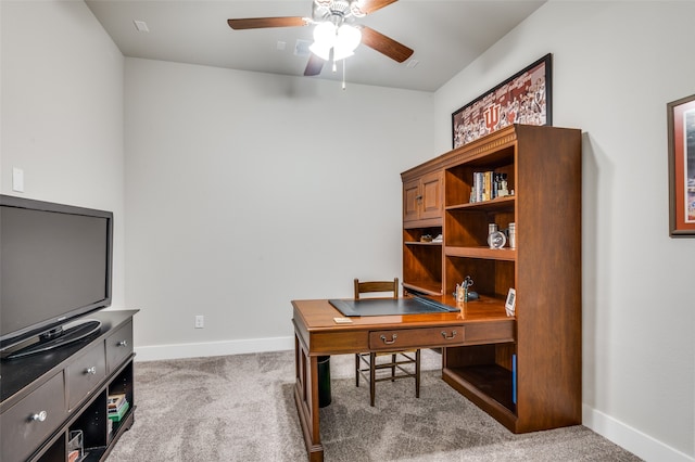 home office with ceiling fan and carpet