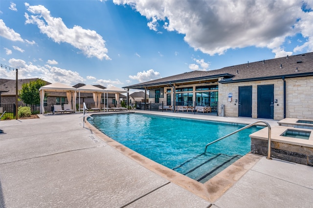 view of swimming pool with a gazebo and a patio area