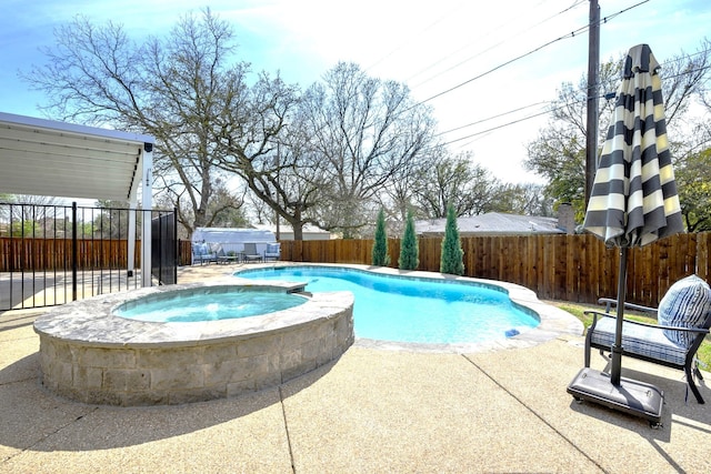 view of pool with a patio area and an in ground hot tub