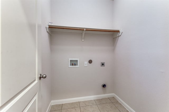 laundry area featuring gas dryer hookup, light tile patterned floors, washer hookup, and hookup for an electric dryer