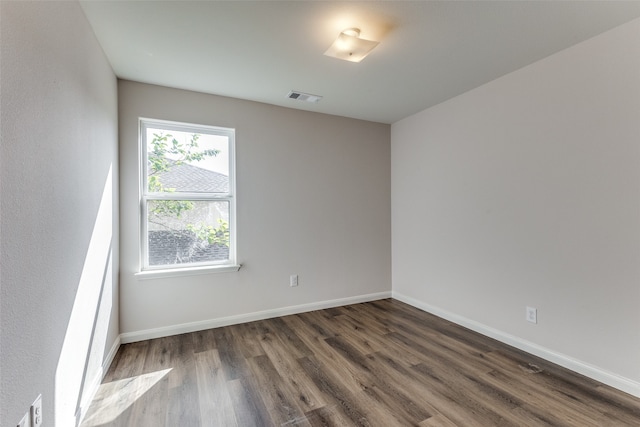 spare room with hardwood / wood-style floors