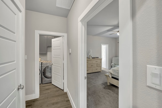 hall featuring washer and dryer and dark hardwood / wood-style floors