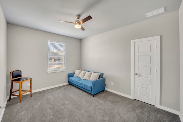 sitting room with light carpet and ceiling fan