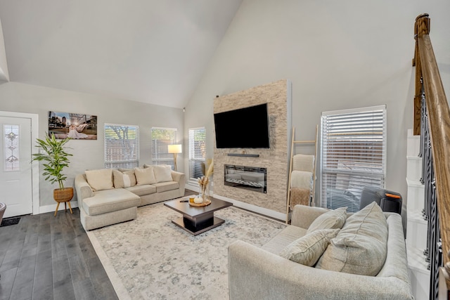 living room with high vaulted ceiling and dark hardwood / wood-style flooring