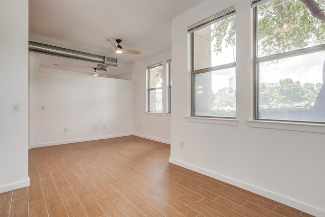 unfurnished room with light hardwood / wood-style floors and ceiling fan