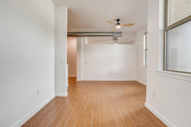 unfurnished room with light hardwood / wood-style flooring and ceiling fan