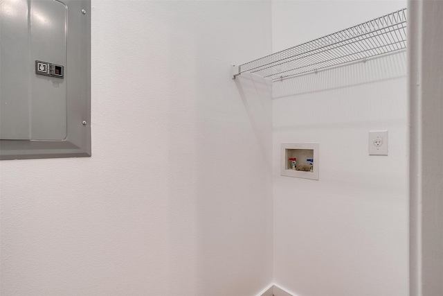 clothes washing area featuring hookup for a washing machine, electric panel, and electric dryer hookup