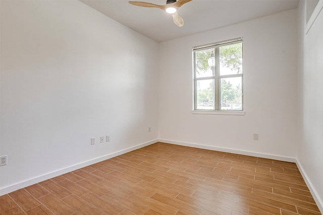 spare room featuring ceiling fan and light wood-type flooring