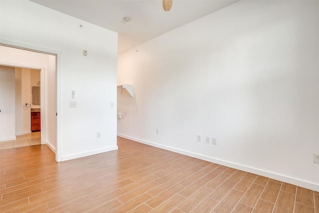 unfurnished room featuring light hardwood / wood-style floors and ceiling fan