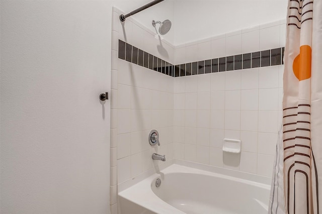 bathroom with shower / bathtub combination with curtain