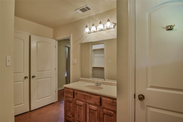 bathroom featuring tile patterned floors and vanity