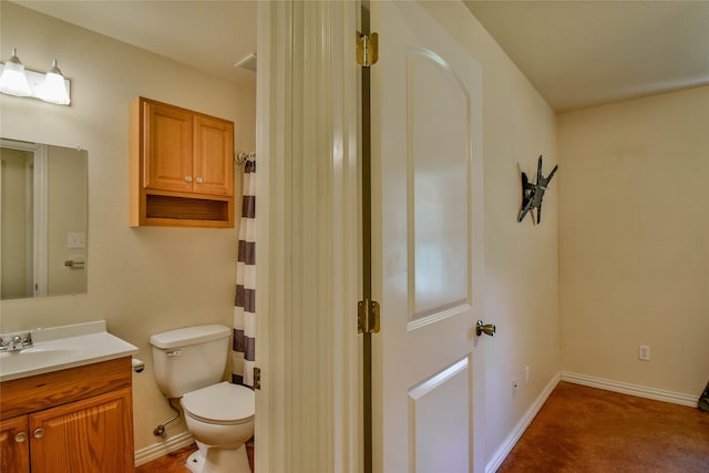 bathroom with vanity and toilet