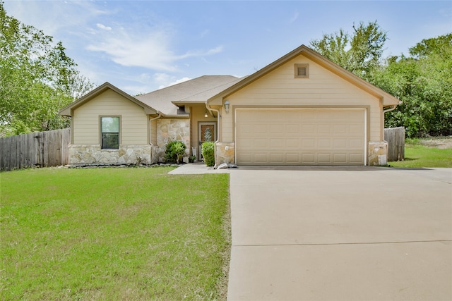 ranch-style house with a garage and a front yard