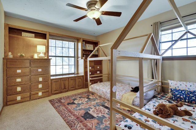 carpeted bedroom with ceiling fan