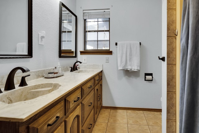 bathroom featuring tile patterned floors and double sink vanity