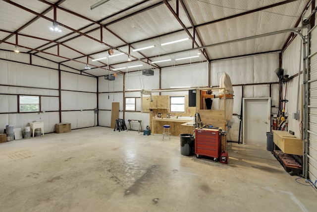 garage featuring a workshop area and a garage door opener