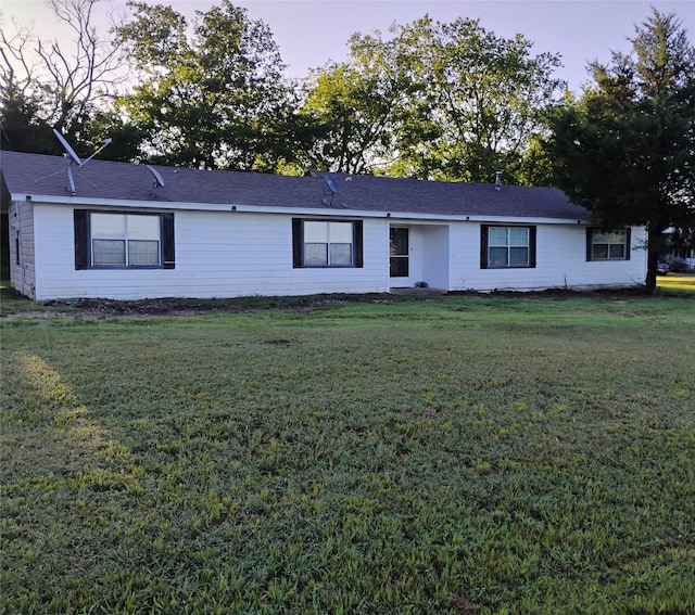 ranch-style house with a lawn