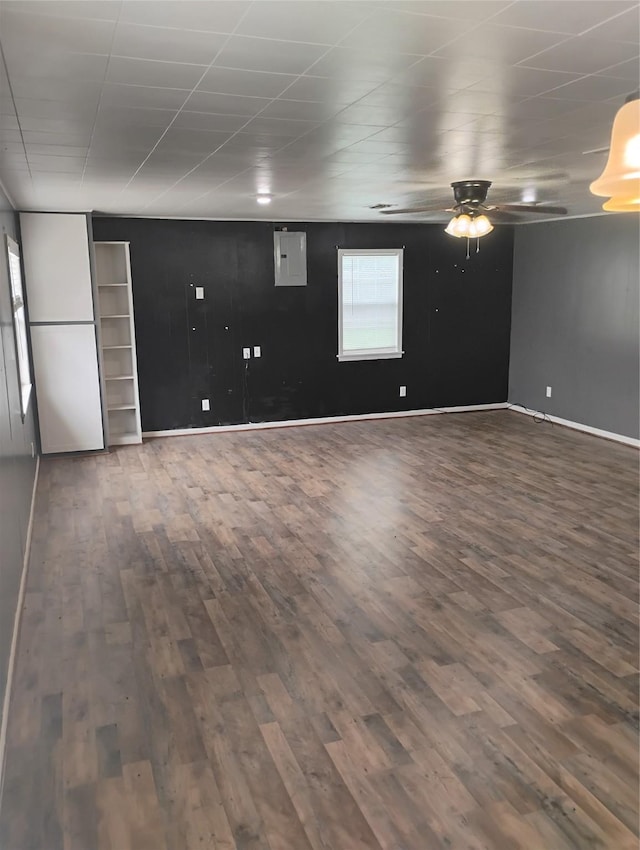 interior space featuring dark wood-type flooring and ceiling fan