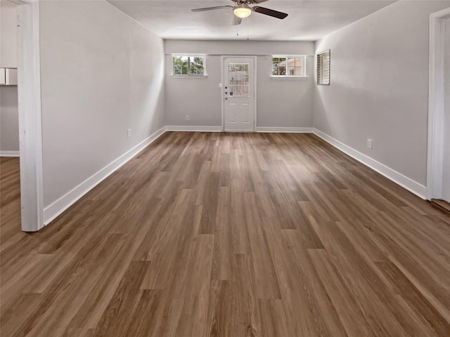 interior space featuring ceiling fan and dark hardwood / wood-style flooring